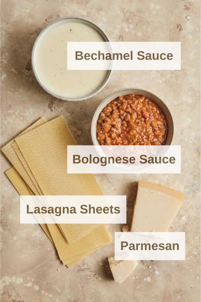 Ingredients needed to make a italian beef lasagna. Bechamel sauce, Bolognese sauce, Lasagna sheets and Parmesan cheese.