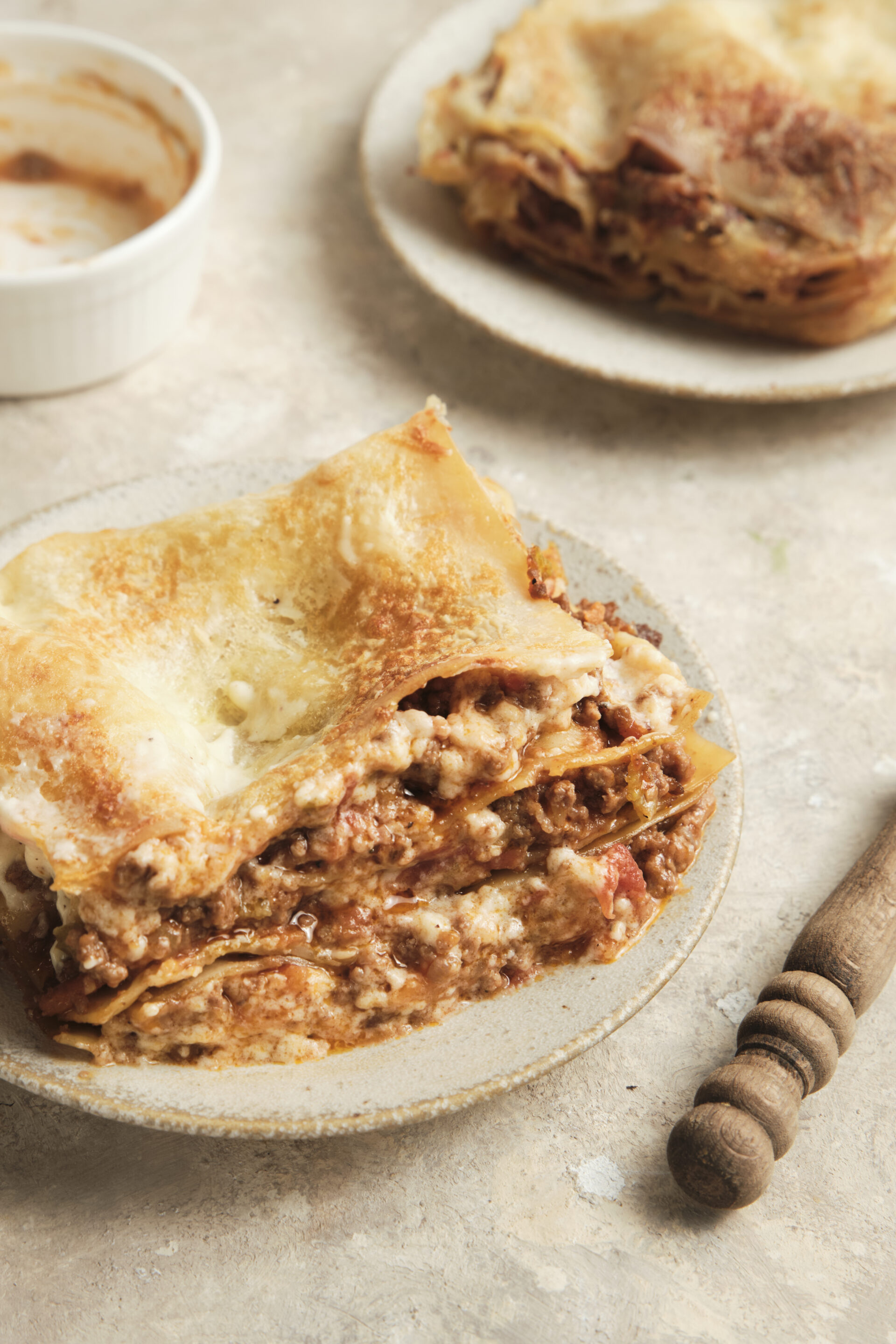Italian Beef Lasagna cut into portion a plated on a plate