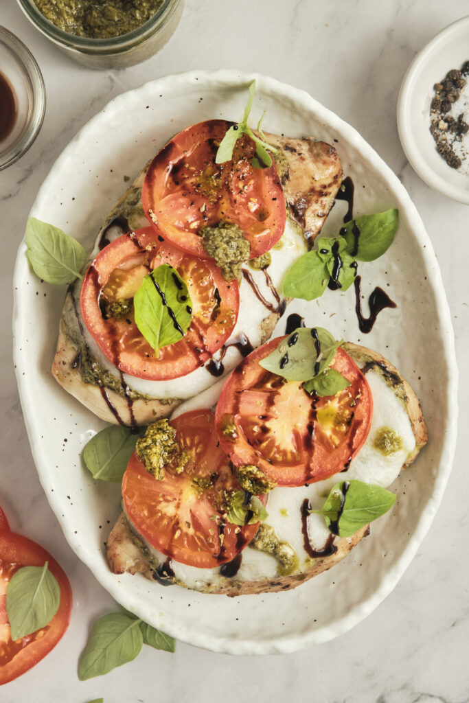 Caprese chicken with melted mozzarella and fresh basil