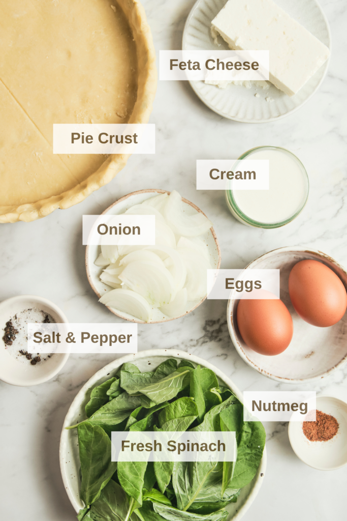 Ingredients for spinach feta quiche with fresh spinach, feta cheese, eggs, and pastry—simple components for an easy spinach quiche recipe and vegetarian quiche ideas.