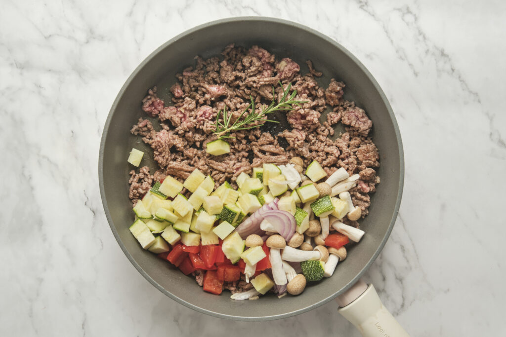 ground beef in a skillet with vegetables