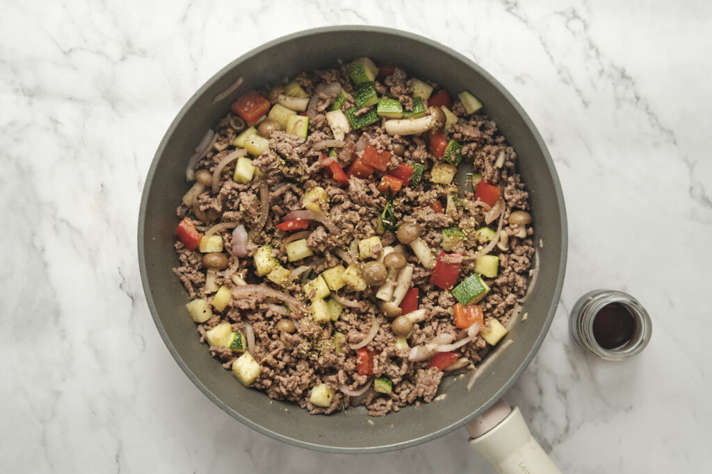 ground beef in a skillet with vegetables