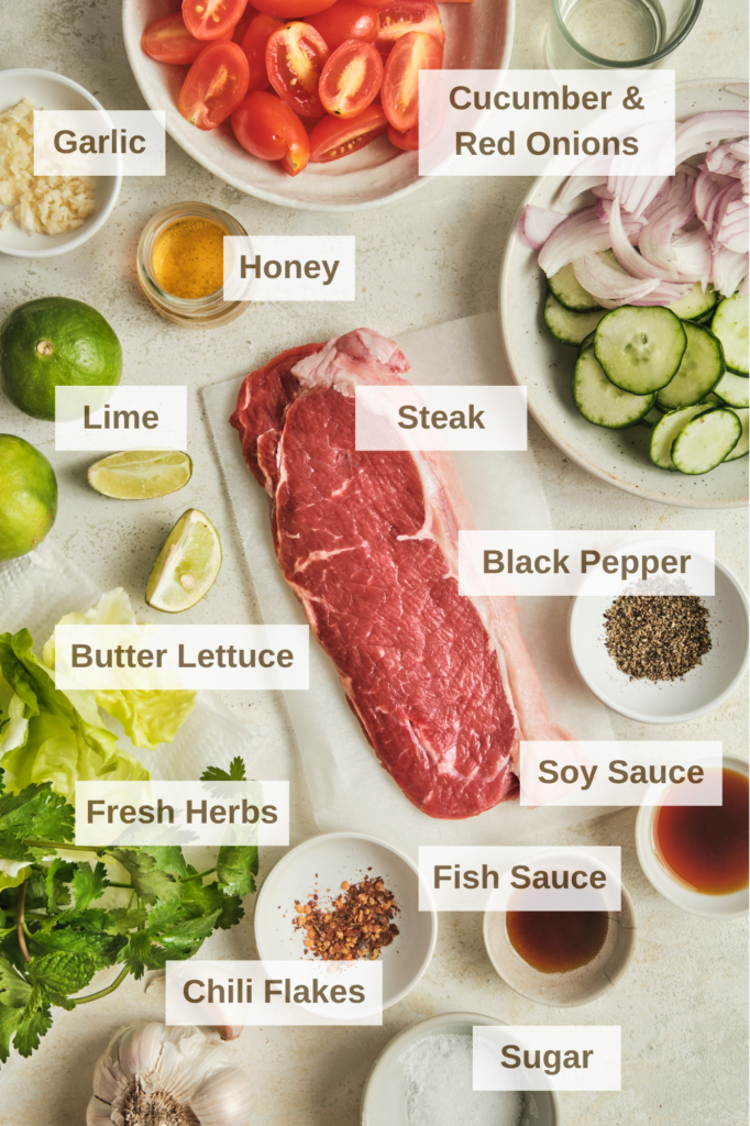 Ingredients needed to make a thai-inspired steak salad with lime dressing.