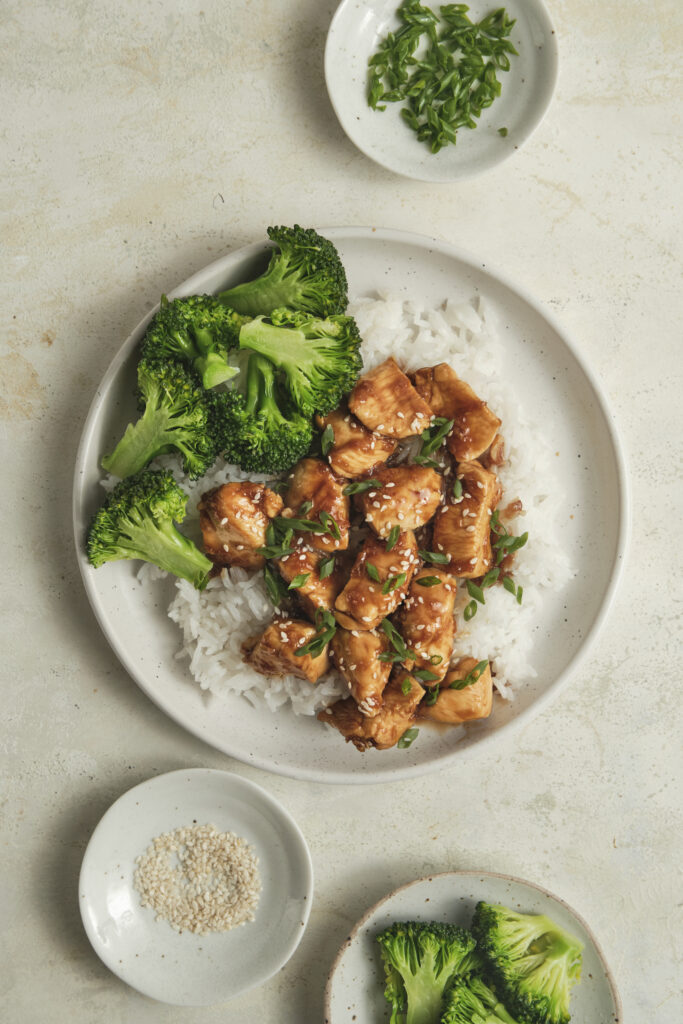 Close-up of chicken teriyaki served over fluffy rice