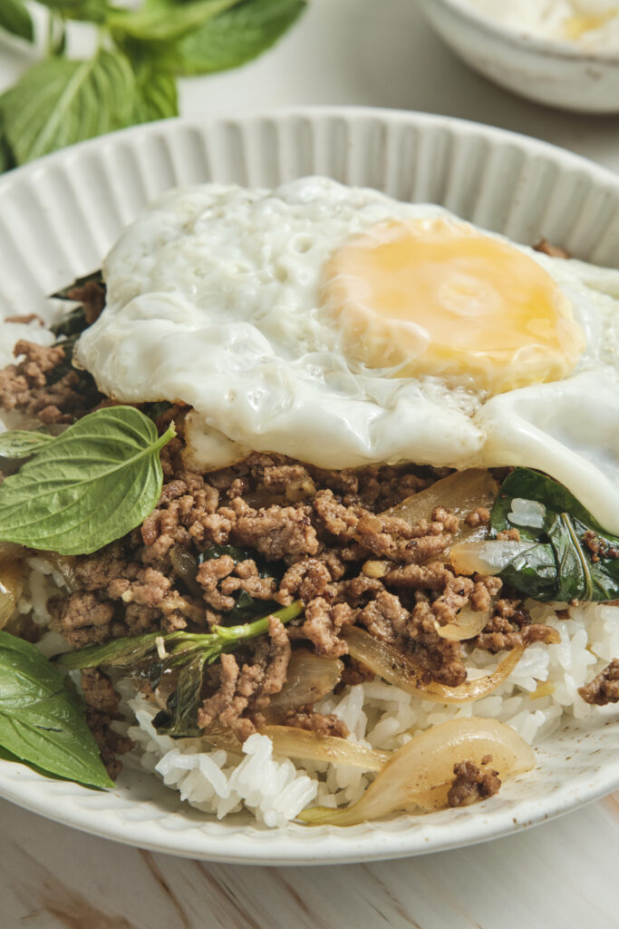 Thai basil beef served over rice with fried egg on top