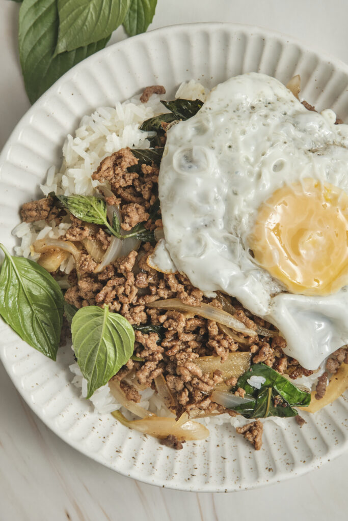 Thai basil beef served over rice with fried egg