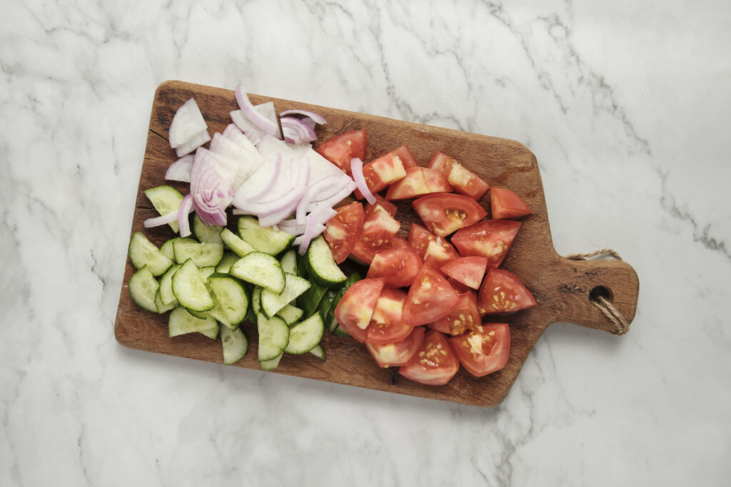 chopped ingredients on a wooden board