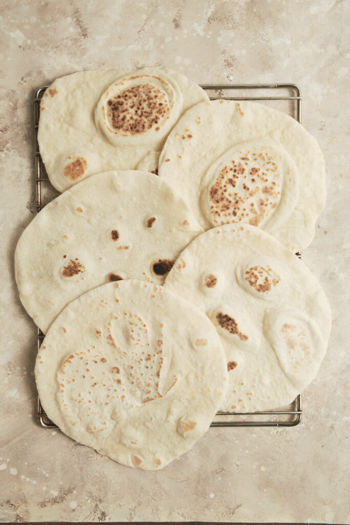 freshly baked lavash bread on a oven rack