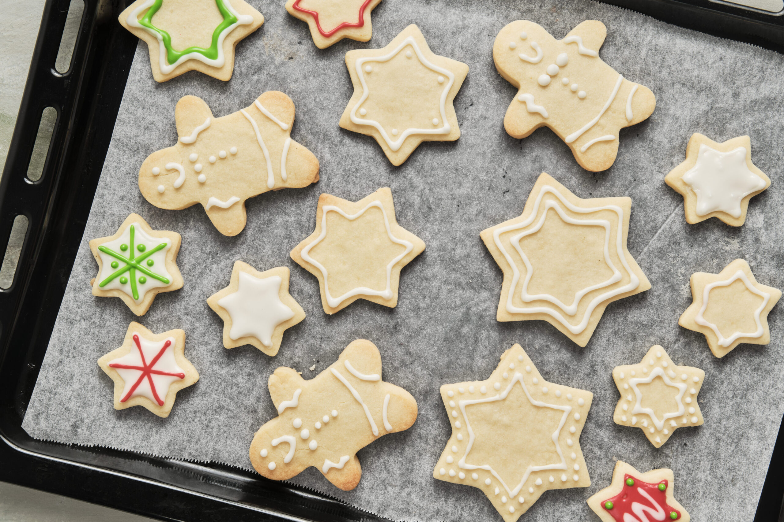 Baked German Christmas cookies with icing decoration